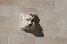 Stone Gargoyle Head Sculpture On The Wall In Dubrovnik, Famous Travel Destination In Croatia; Acting As A Spout To Carry Water Clear Of A Wall