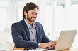 © Yuri A/peopleimages.com - Work is a breeze today. A handsome businessman working on his laptop.