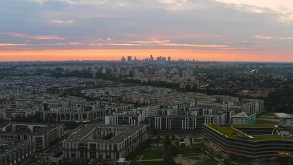 Wall Mural - Warsaw distant city center and Wilanow district at dawn aerial footage