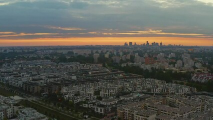 Wall Mural - Warsaw distant city center and Wilanow district at dawn aerial footage