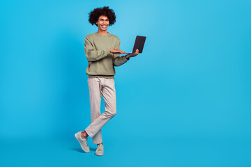 Sticker - Full size photo of young man standing use laptop agent representative isolated over blue color background