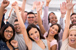 © Yuri A/peopleimages.com - End of year party Woohoo. Shot of a group of smiling businesspeople raising their hands.