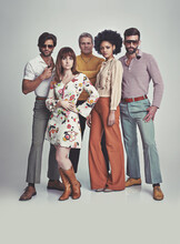 Nothing Like Some 70s Style. A Studio Shot Of A Group Of People Standing Together While Clad In Retro 70s Wear.