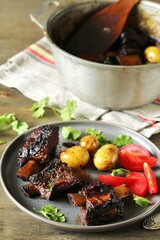 Poster - short ribs stew with new potatoes.
long stewed meat. serving with tomatoes and herbs