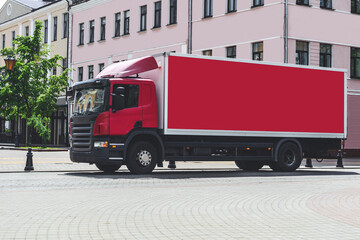 Mockup red big truck. Against the backdrop of the city.