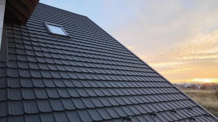 Wall Mural - Closeup of house roof top covered with metallic shingles.Tiled covering of building