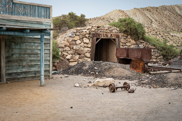 Rusty wagon in the old abandoned gold mine in the old west