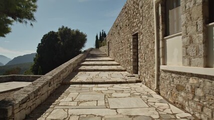 Wall Mural - Stairs besides the museum of an ancient greek location in golden sunlight
