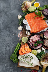 Wall Mural - Fresh seafood arrangement on dark background.