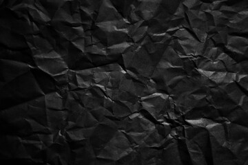 Poster - Textured crumpled black paper background.