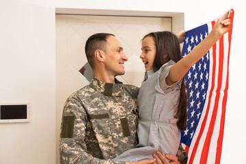 Wall Mural - Veteran soldier comes back to his family from the military.