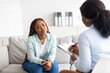 © Prostock-studio - Anxious black woman having counseling session with therapist at clinic, receiving professional help and support
