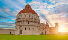 Cathedral (Duomo Of Santa Maria Assunta) And The Baptistery Of Pisa Leaning Tower At The Piazza Dei Miracoli Or The Square Of Miracles - Pisa, Italy