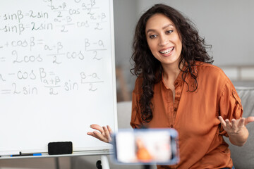 Poster - Female teacher giving online lesson to students recording video