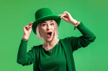 St. Patrick's Day. Beautiful Smiling Woman Wearing Green Hat.