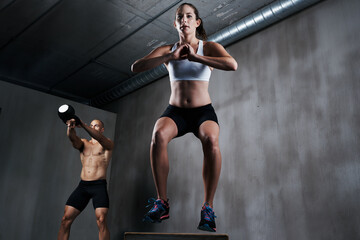 Poster - Training to become fighting fit. A workout session in a gym.