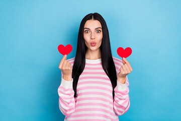 Wall Mural - Photo of young adorable girl send air kiss hold little heart figure coquettish isolated over blue color background