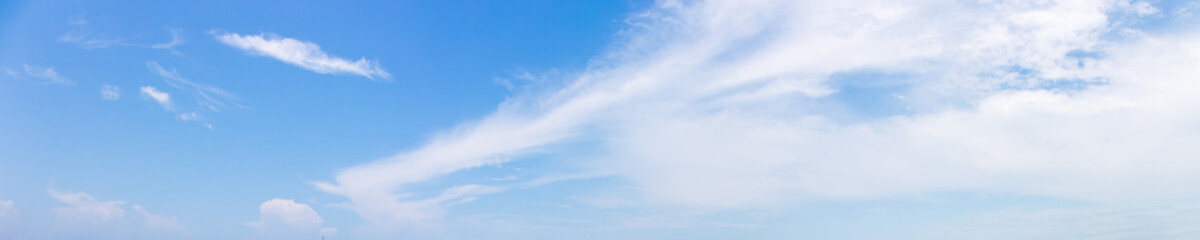 Wall Mural - panorama or panoramic photo of blue sky and white clouds or cloudscape.