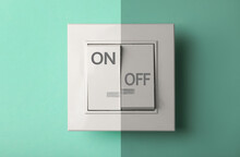 Turned ON And OFF Light Switch On Turquoise Background