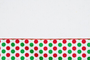 Wall Mural - Christmas background with red and green polka dots white sparkles felt