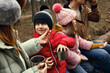 © New Africa - Happy family with hot drinks spending time together in forest