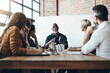 © Nola Viglietti/peopleimages.com - Always striving for greater success. Cropped shot of a mature businessman leading a meeting in the boardroom.