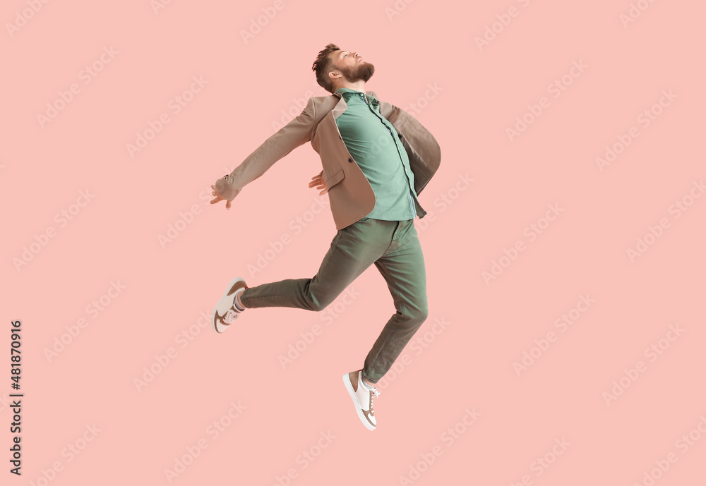 Cool dancing young man on color background