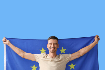 Sticker - Young man with flag of European Union on color background