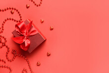 Gift For Valentine's Day On Red Background