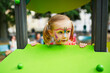 © Ekaterina Pokrovsky - Little preschooler girl with butterfly face painting outdoors