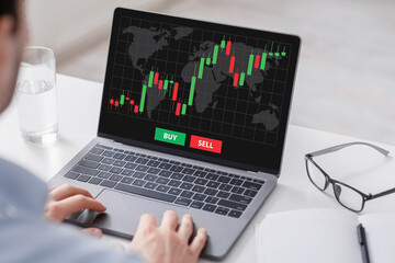 Aufkleber - Cropped of businessman analysing market online on laptop, office interior