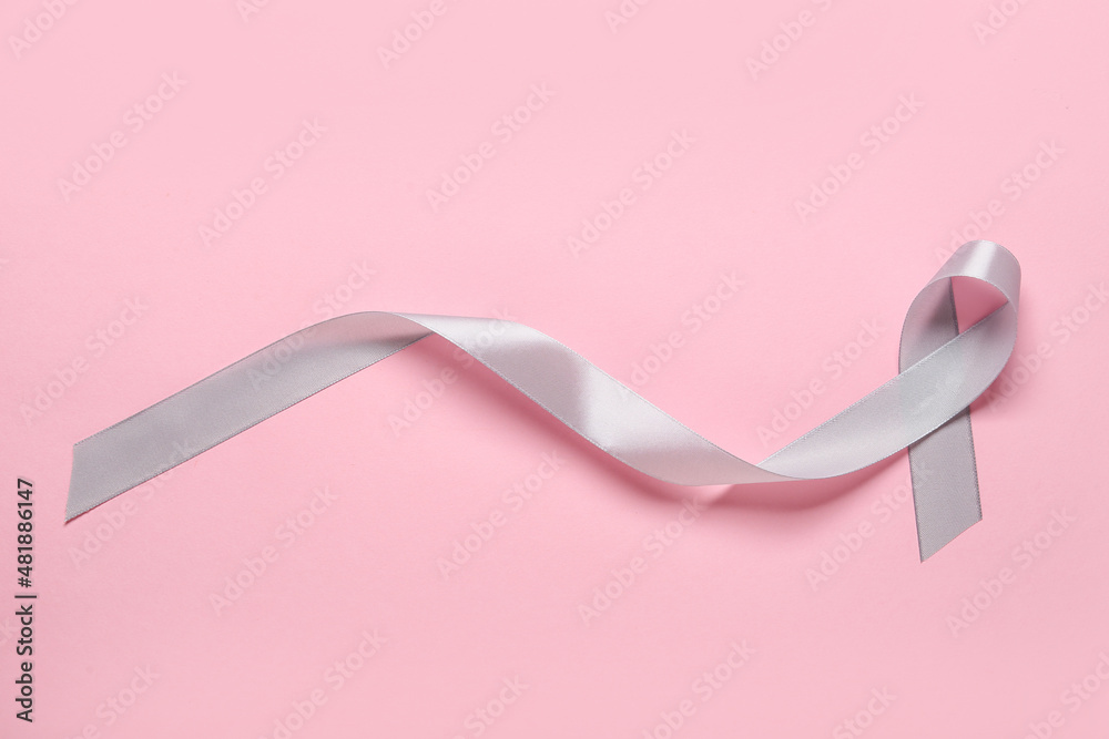 Parkinson's awareness ribbon on pink background
