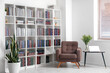 © Pixel-Shot - Bookcase with armchair in modern interior of room