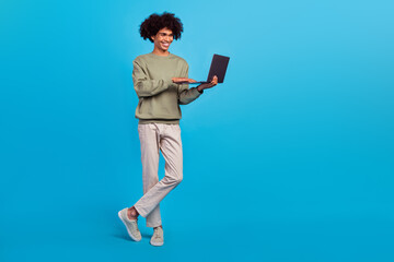 Poster - Full length photo of young guy use laptop chat type speak presentation expert isolated over blue color background