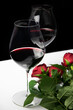 
Valentine's day with a glass of wine and red roses