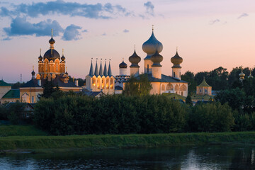 Wall Mural - View of the ancient Tikhvin Assumption Monastery on a August evening. Tikhvin, Leningrad region. Russia