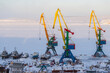 © Andrei Stepanov - Cargo seaport in the Arctic. Large harbor cranes on a background of ice and snow. Winter industrial landscape. Industry and transport infrastructure in the Far North. Anadyr sea port, Chukotka, Russia