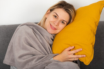 Wall Mural -  Sick woman lying on the couch