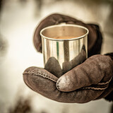 Fototapeta Dmuchawce - cup of coffee in winter