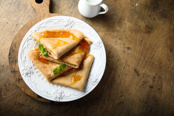 Wall Mural - Homemade crepes with apricot jam