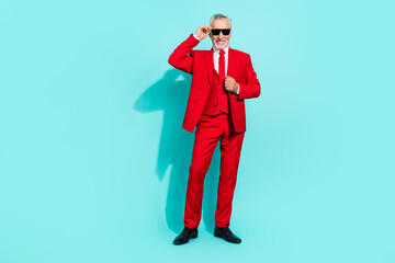 Sticker - Photo of pretty retired man wear red three piece suit arm dark eyewear smiling isolated turquoise color background