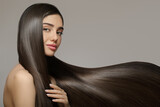 Fashion woman with straight long shiny hair. Beauty and hair care