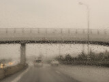 Fototapeta  - Stormy weather with heavy rain - the view from the car window. Israel