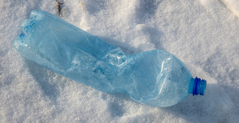 empty used plastic bottle as a symbol of environmental pollution