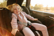 © ADDICTIVE STOCK - Cute girl in child seat during trip