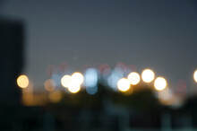 Blur Bokeh Light On Black Background.Light From Top Of Building.View Of Copy Space.