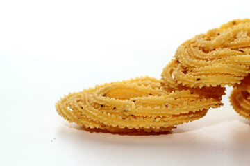 Wall Mural - Murukku is a popular South Indian fried snack made with rice flour, lentil flours, spices and seasonings