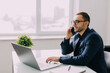 © F8  \ Suport Ukraine - Businessman talking on the phone sitting at office desk
