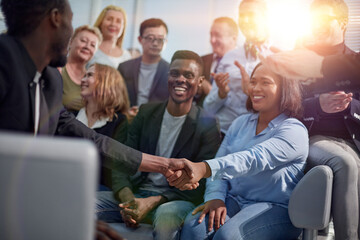 Handshake between a businesswoman and a co-worker