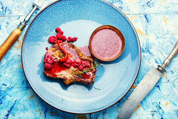 Wall Mural - Pork steak with berry sauce.